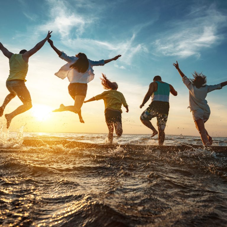 Happy friends runs to sunset lake after party Happy friends runs to sunset lake after party